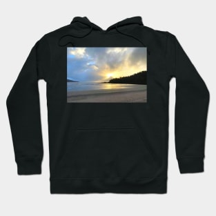 Sunshine bursting through the clouds at the sandy beach Hoodie